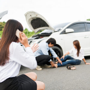 Woman at crash scene calling Fort Valley car accident lawyer for accident