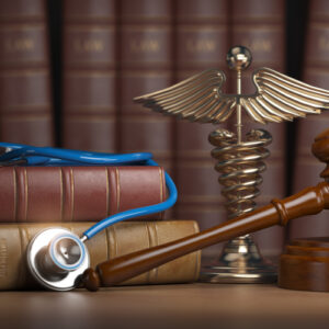 Stethoscope and law books on the desk of an Americus personal injury lawyer