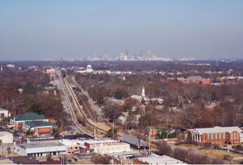 Aerial view of College Park, Georgia, with the skyline of Atlanta in the background