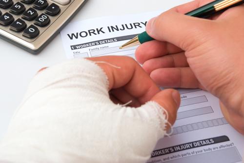 An employee with an injured hand filing for workers' compensation